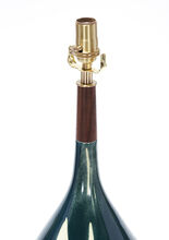 miller in custom dark teal drape